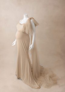 a pregnant woman wearing a dress